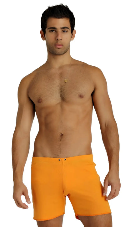 Bright orange fusion yoga short swim trunks with simple design and two front button closures for active wear