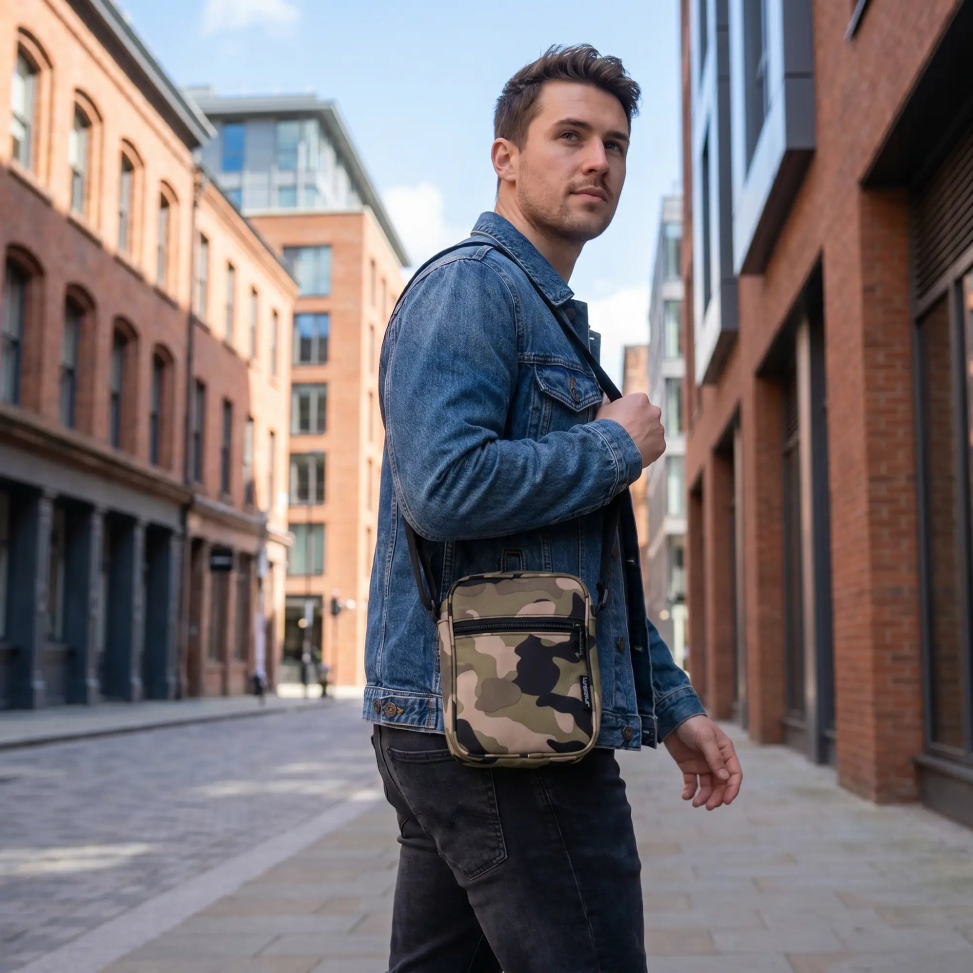 Man wearing Fydelity camouflage crossbody sling bag in an urban outdoor setting — FYDELITY men's bags