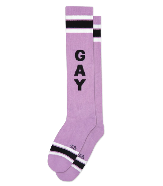 Lavender knee high socks with bold black gay lettering and white and black striped accents for casual wear
