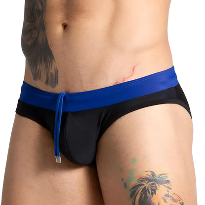 Black swim trunks gigo alfa with a bold blue waistband and matching drawstring for stylish beachwear