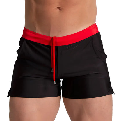 Black swim trunks with bold red waistband and matching drawstring from gigo alfa black red beachwear collection