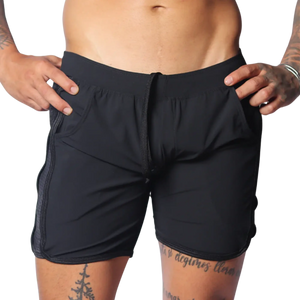 Black athletic shorts with an elastic drawstring waist, side pockets, and perforated panels on the side seams.