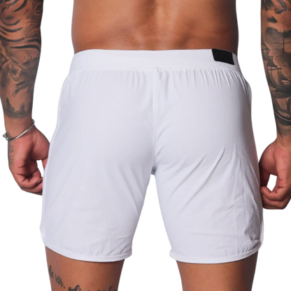 Plain white athletic shorts with a smooth, lightweight fabric, elastic waistband, and small black logo tab on the back.