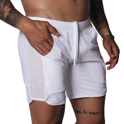 White athletic shorts with a drawstring waistband and side panels made of breathable mesh fabric.