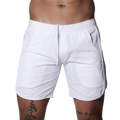 White athletic shorts featuring an elastic waistband with drawstring, side pockets, and curved hem detail.