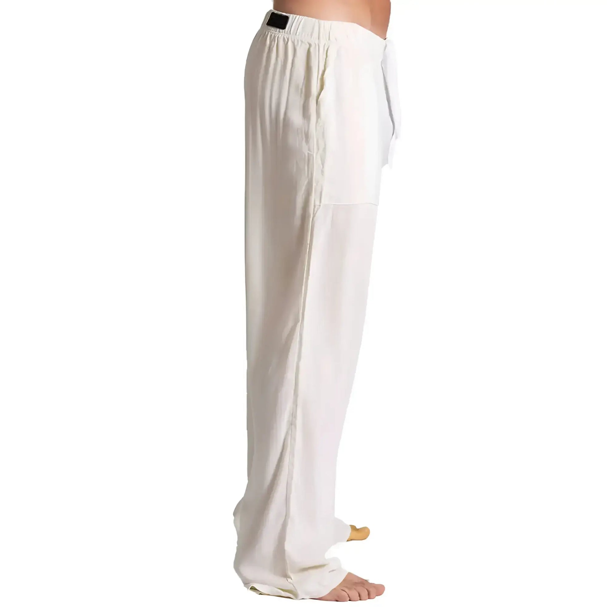 White loose-fitting Gigo Chalis beige pants with drawstring waist and subtle side seam detailing