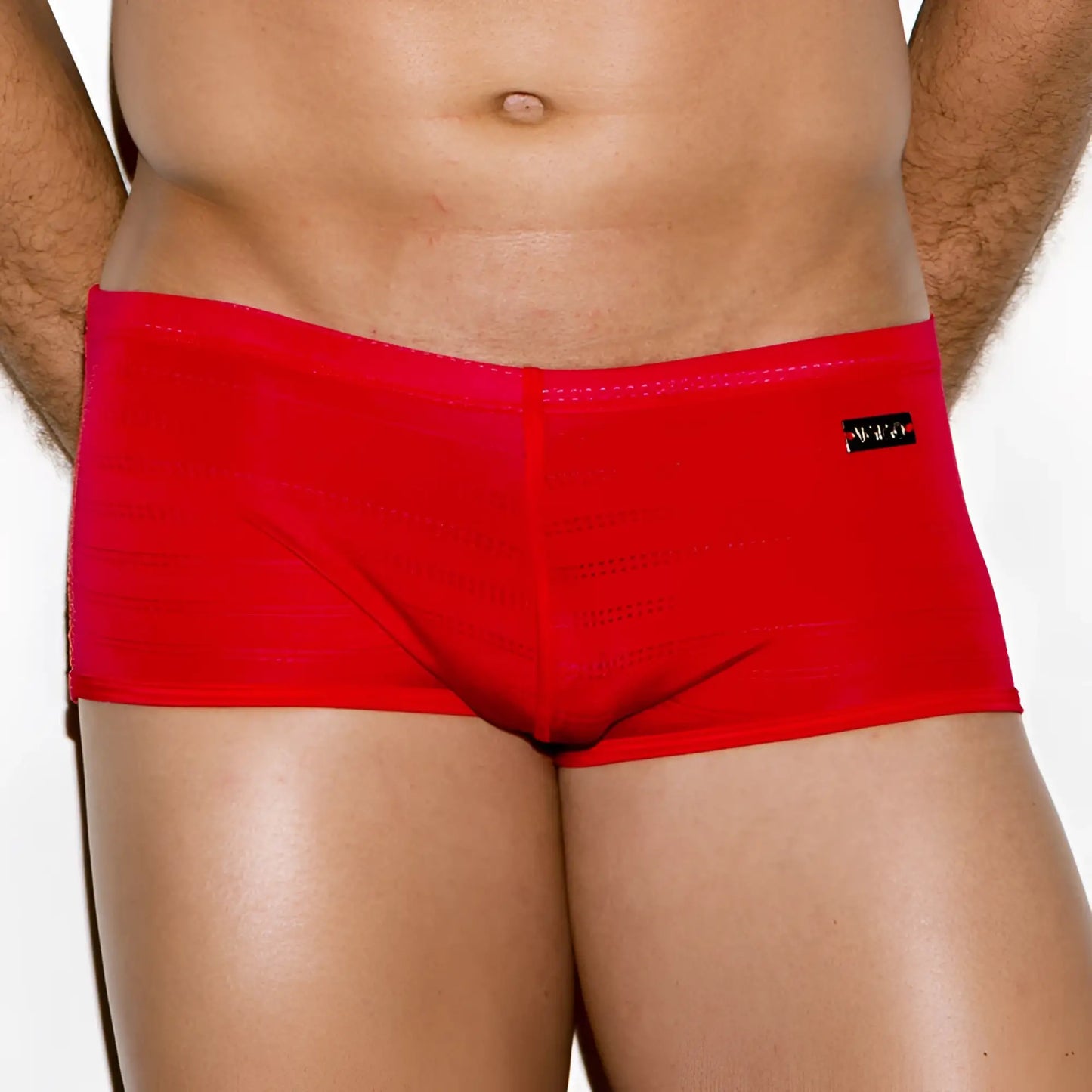 Bright red form-fitting mens briefs with subtle texture and black brand tag on waistband from Gigo classic red collection size m