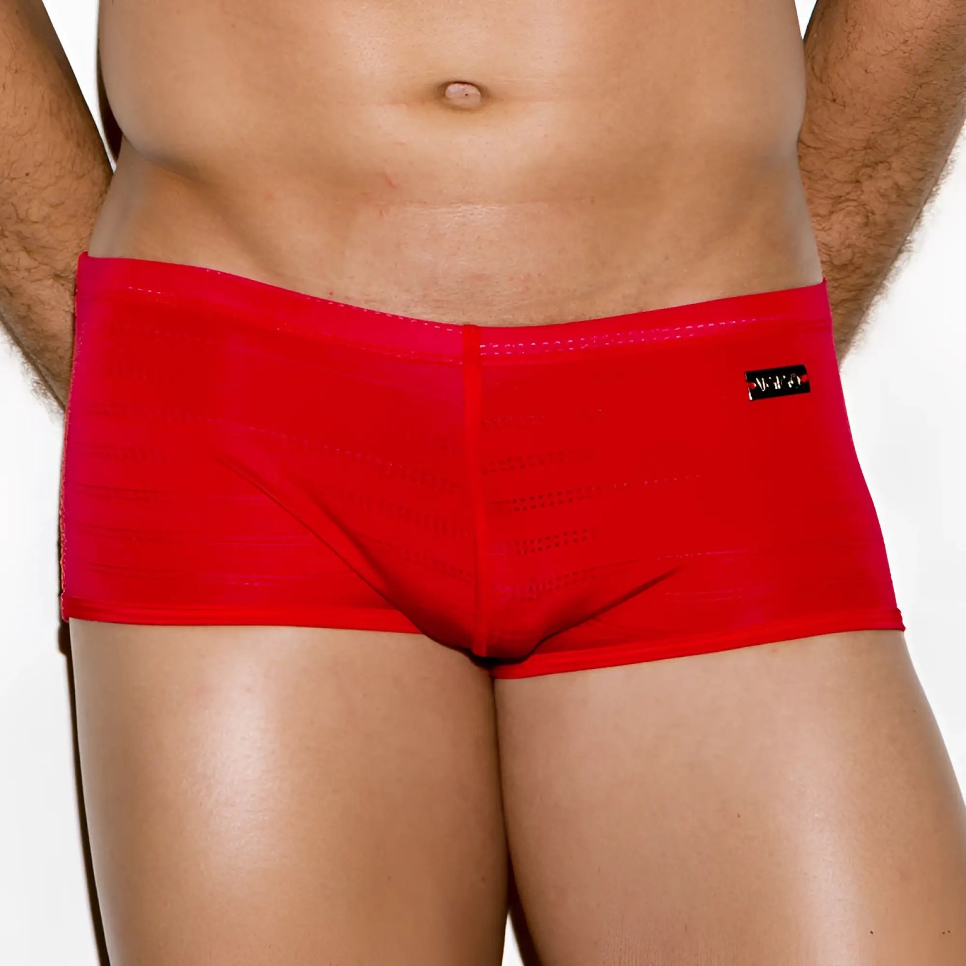 Bright red form-fitting mens briefs with subtle texture and black brand tag on waistband from Gigo classic red collection size m
