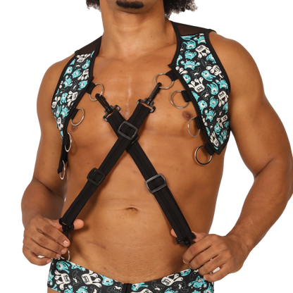 Black gigo comics vest harness with teal and white skull pattern adjustable straps and metal rings visible on front