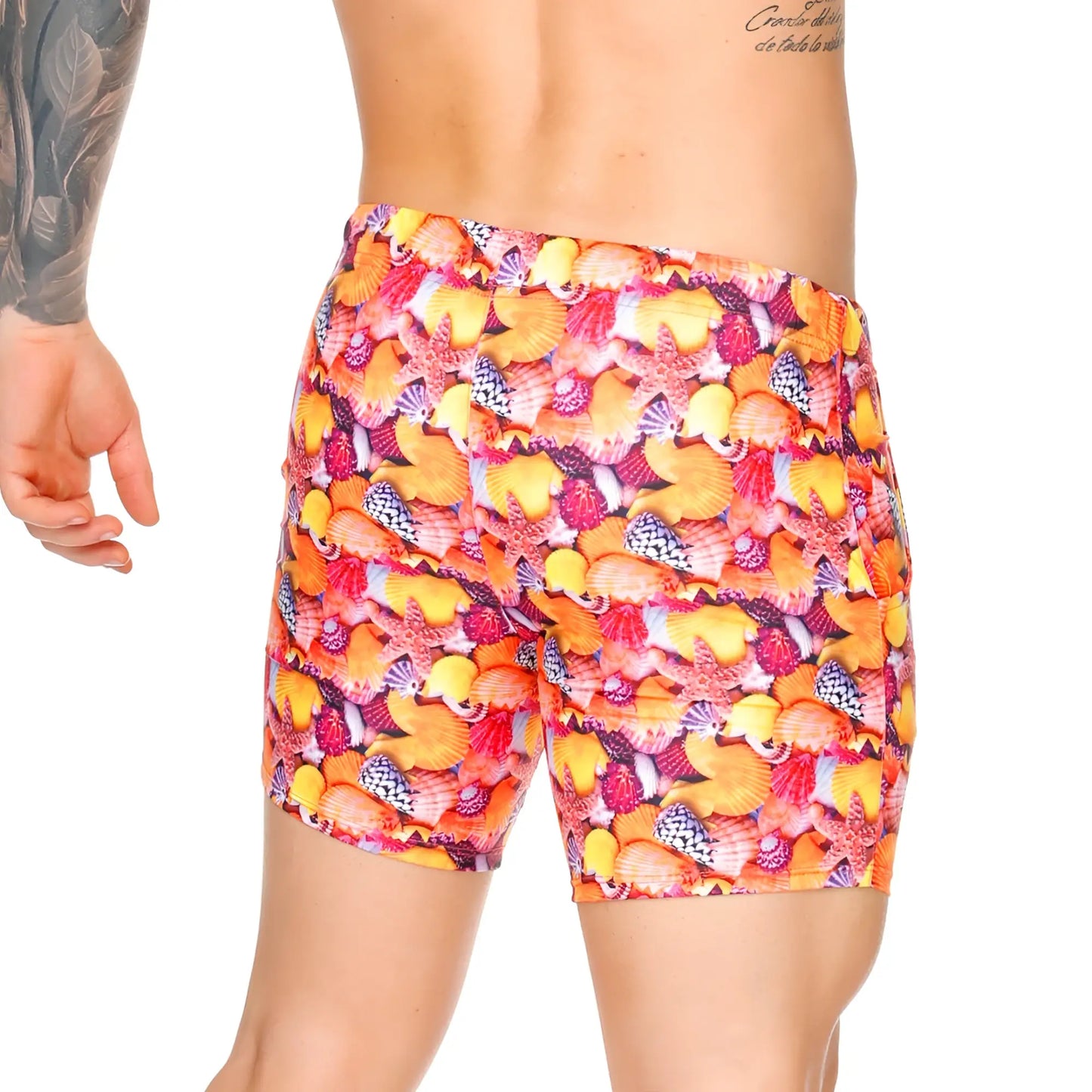 Vibrant orange and pink Gigo Corals swim trunks with seashell starfish and coral pattern for beachwear use