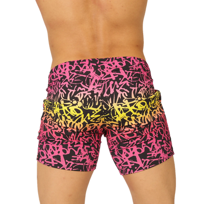 Vibrant gigo crazy beachwear shorts with bold pink and yellow graffiti pattern on black fabric for casual wear
