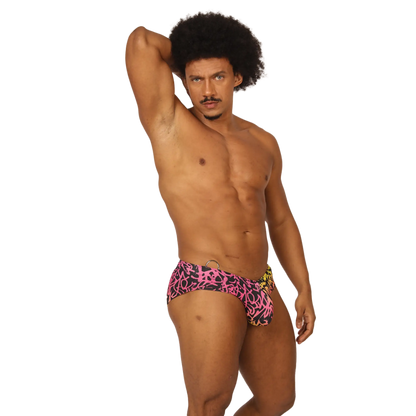 Gigo Crazy Swimbrief swim trunks in vibrant pink and black graffiti pattern with a yellow side accent for swimming