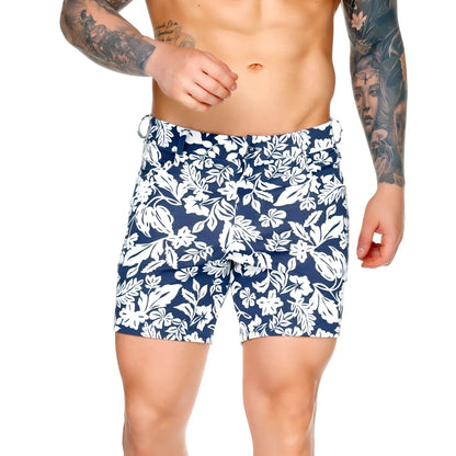 Navy blue Gigo Dynasty Blue short swim trunks with bold white tropical floral pattern for beachwear