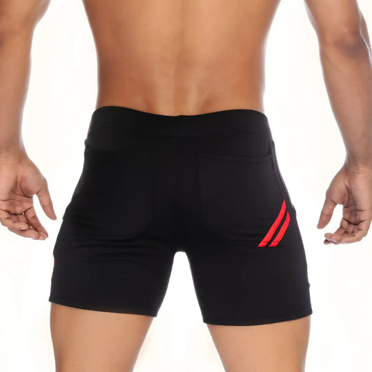 Back side of gigo energy black athletic shorts featuring red diagonal stripes on the back pocket
