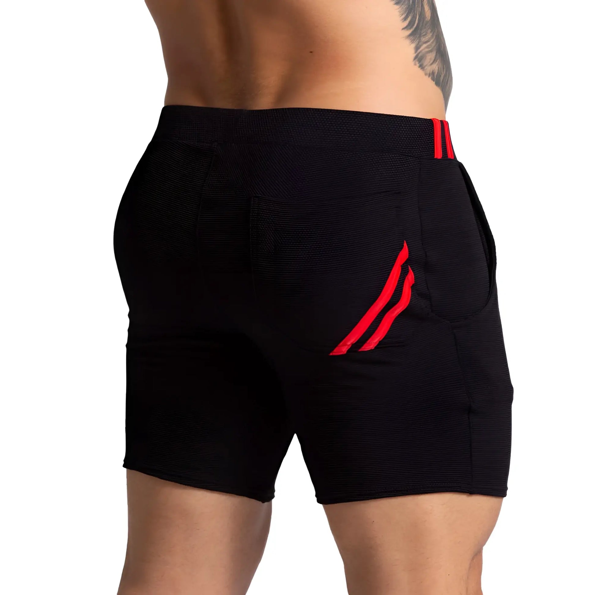 Black athletic shorts with red striped accents on waistband and side pocket gigo f fetish red short