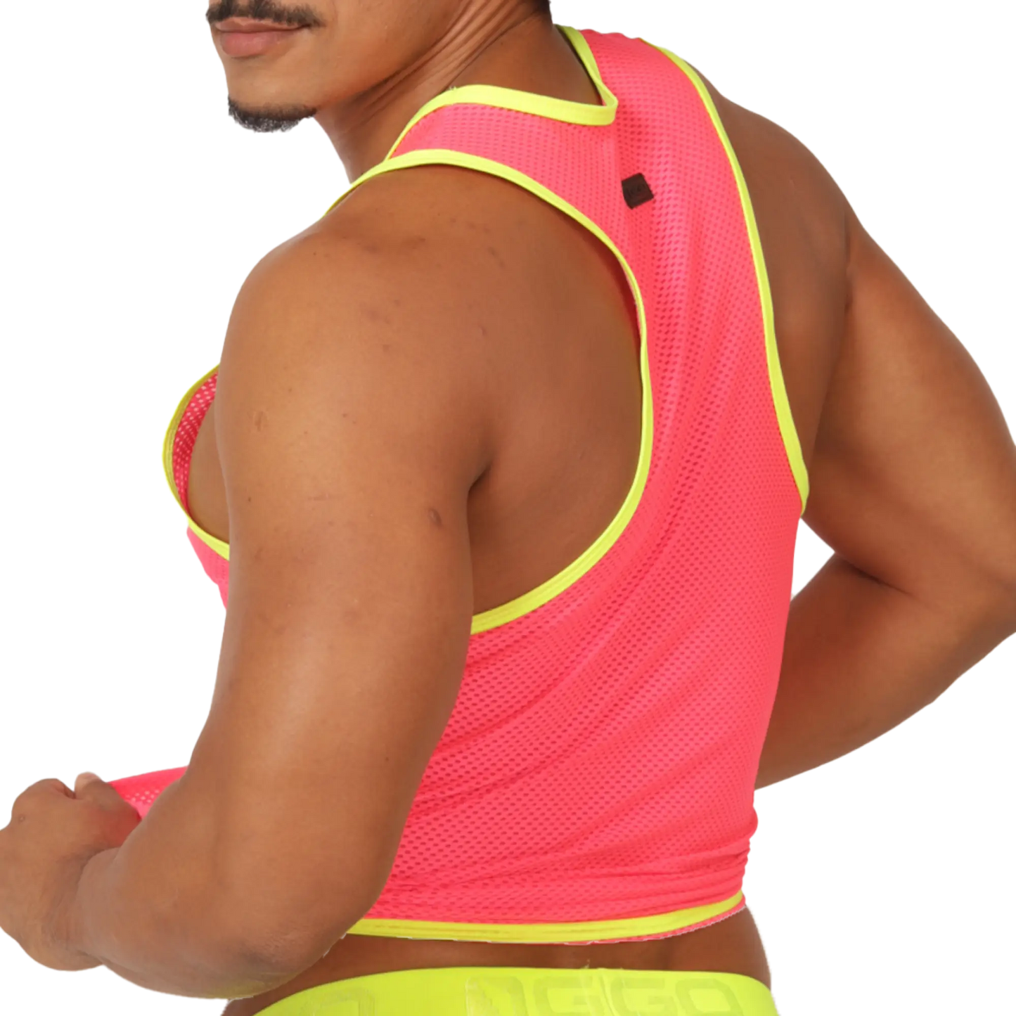 A vibrant neon pink mesh tank top with bold yellow trim and a black logo patch on the shoulder named Gigo Feeling Candy Tank