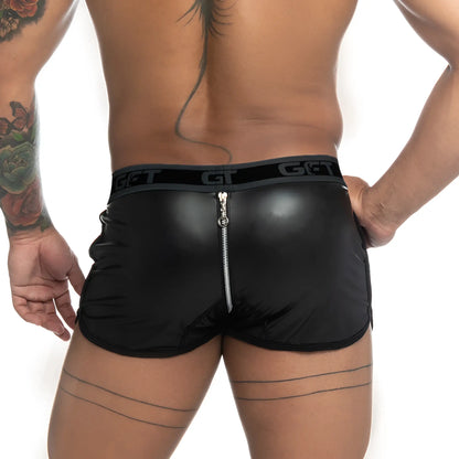 Back view of gigo fetiche black faux leather shorts with silver zipper and elastic waistband featuring get branding