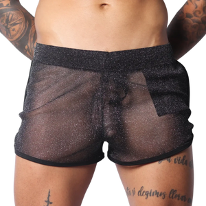 Sheer black metallic glitter shorts with a comfortable elastic waistband and black hem trim.