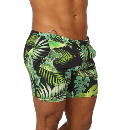 Black swim trunks with vibrant green tropical leaf pattern from Gigo Forest beachwear for summer beach use