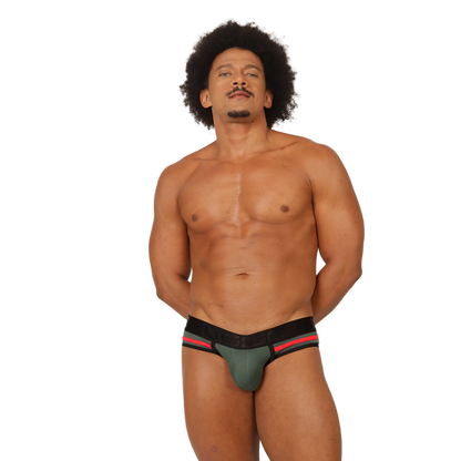 A muscular man with an afro wearing a green black and red gigo garoto athletic brief showing the front side