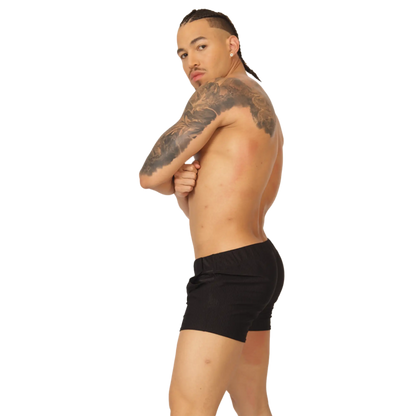Black athletic shorts with a simple sleek design from Gigo Glow ideal for sports and casual wear