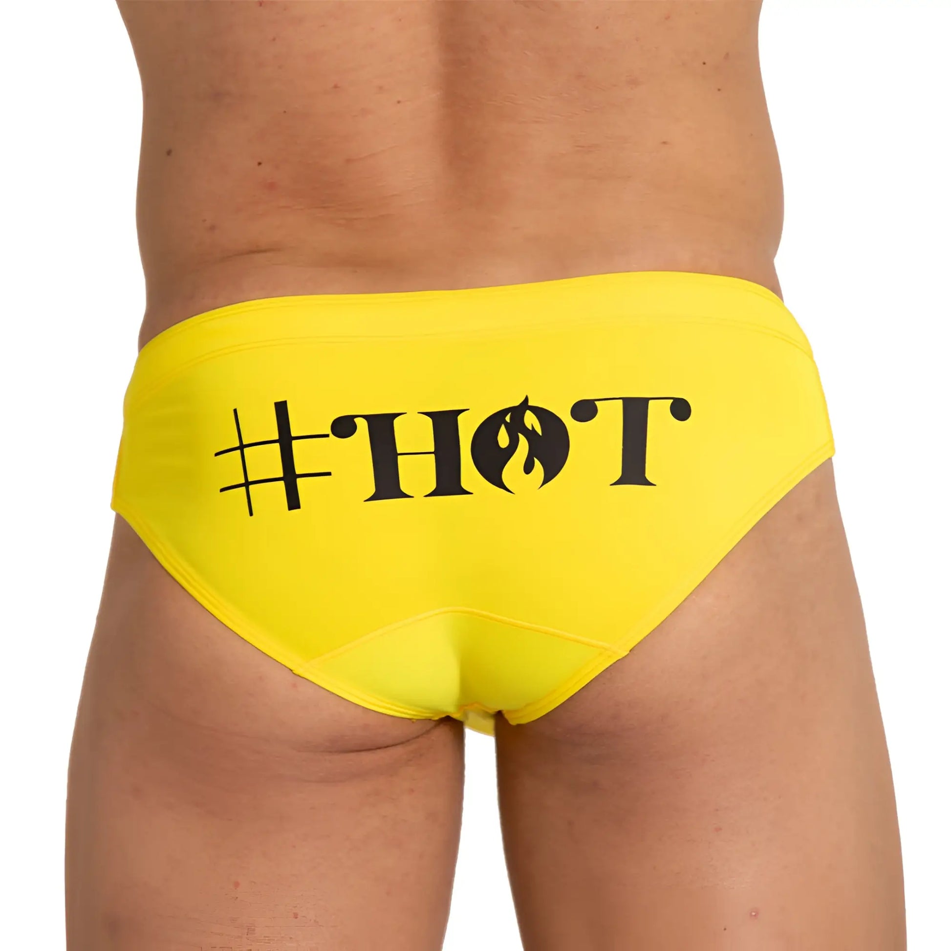 Bright yellow gigo hot swim brief featuring bold black hashtag hot text with flame design on the front