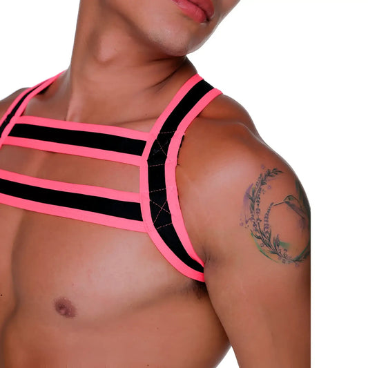 A bold neon pink and black strappy harness top with a geometric cage like design called gigo medieval candy harness