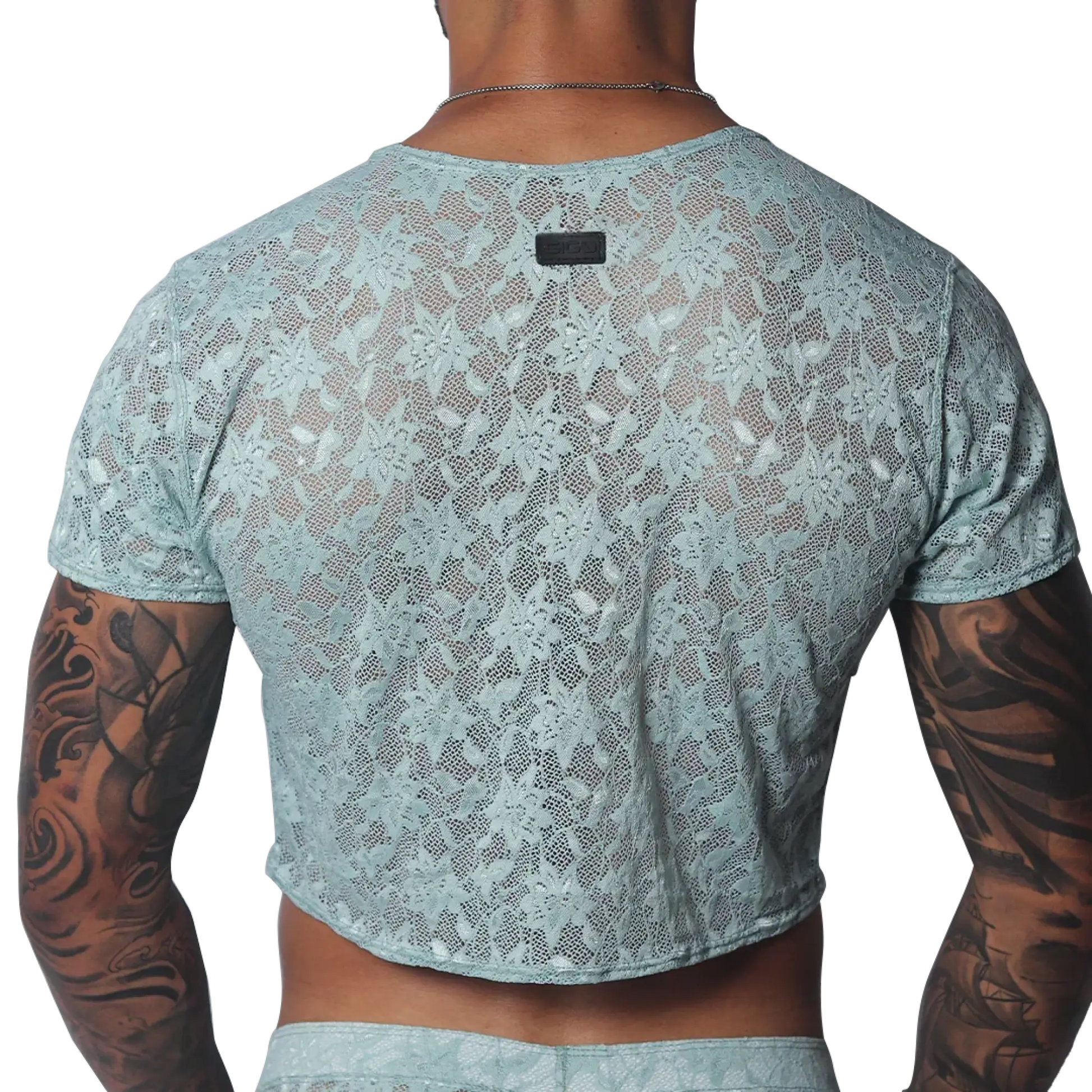 Aqua floral lace crop top with short sleeves and a small black brand tag at the back neckline.