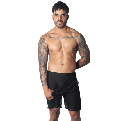 Form-fitting black athletic shorts featuring a layered design with a sheer, open-mesh outer panel.