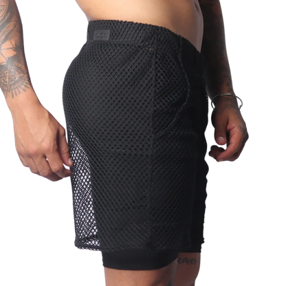 Black athletic shorts in a large-grid fishnet material with a solid inner layer and a branded elastic waistband.