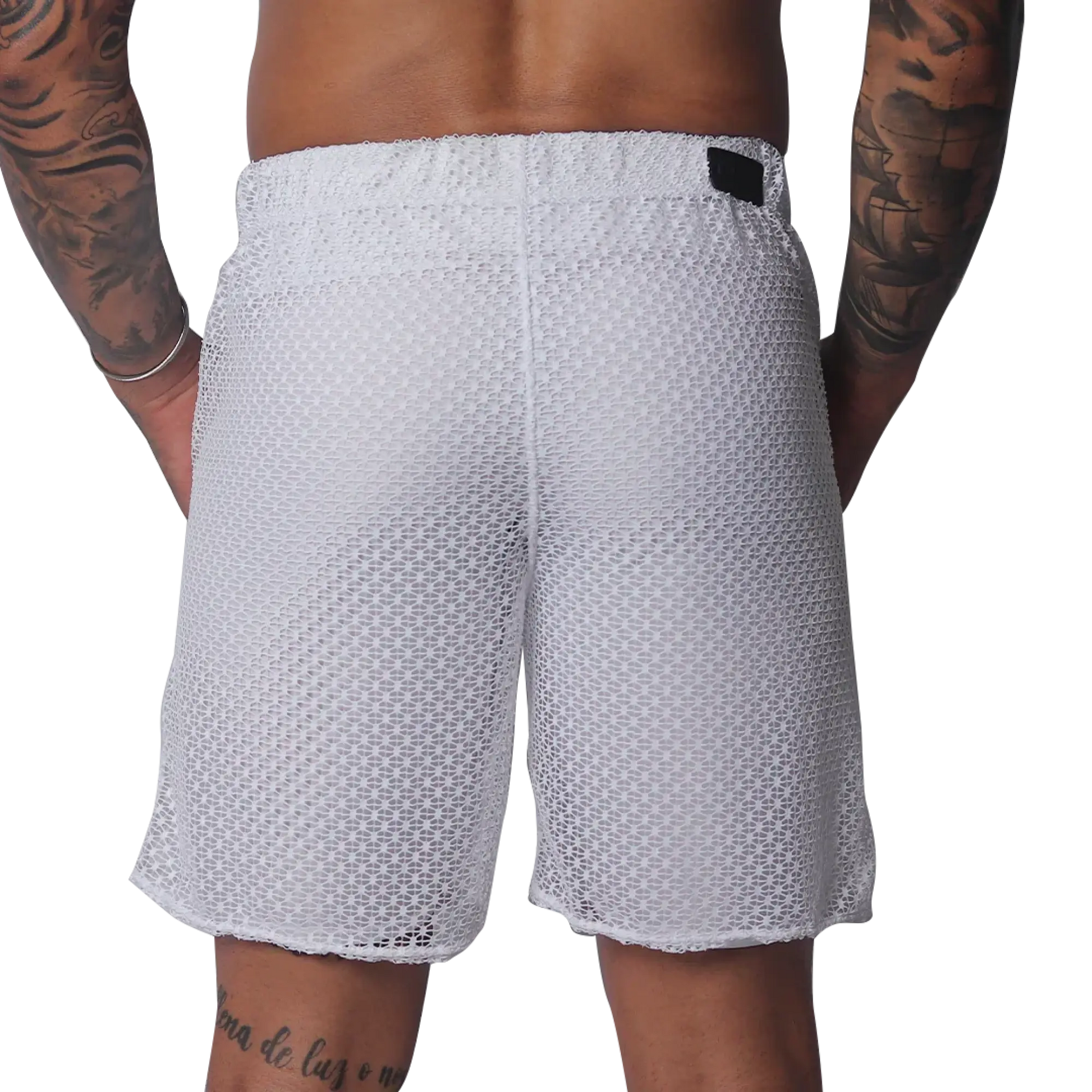 White mesh athletic shorts with an elastic waistband and a small black rectangular brand patch on the back.