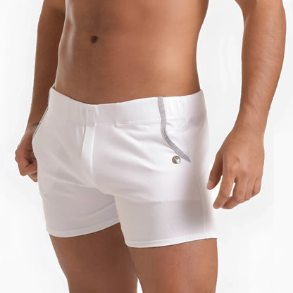 White menâ€™s swim trunks gigo scanaling with subtle ribbed texture and silver zipper detail