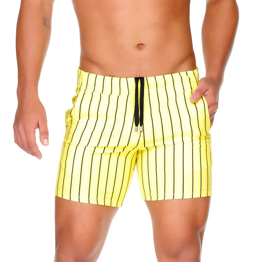 Bright yellow Gigo Sultan swim trunks with bold black vertical stripes and a matching drawstring waistband for beachwear
