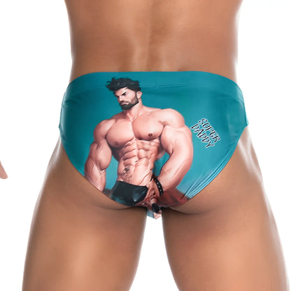 Teal gigo super daddy blue swim brief featuring a printed muscular man illustration and super daddy text on the side