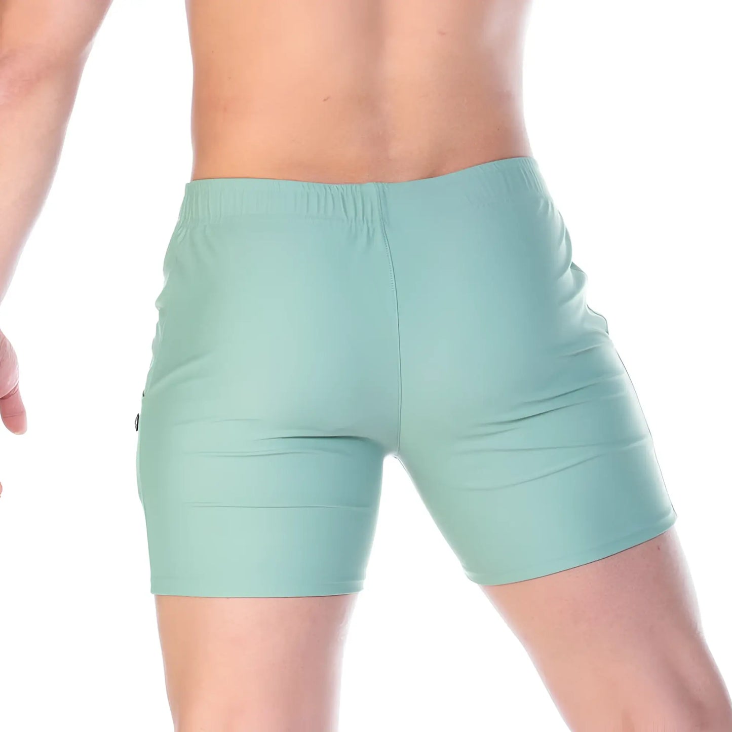 Mint green athletic shorts with elastic waistband and sleek form fitting design from gigo traditional green beachwear
