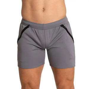 Gray athletic shorts with black zipper accents on the sides designed for training by gigo