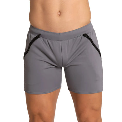 Gray athletic shorts with black zipper accents on the sides designed for training by gigo