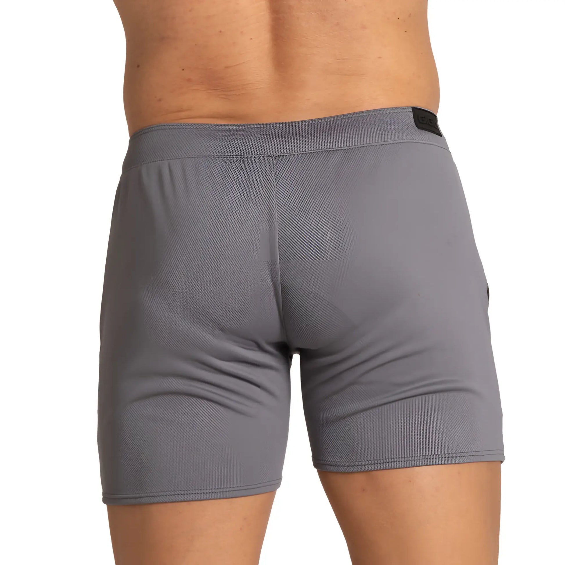 Gigo training gray short with textured breathable fabric and black brand tag at the waistband for athletic use
