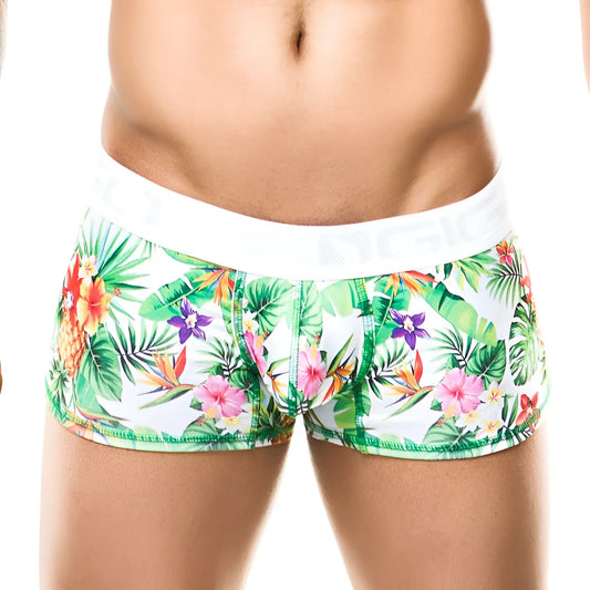 White tropical print briefs by gigo featuring vibrant green leaves pink orange flowers and purple orchids on white fabric