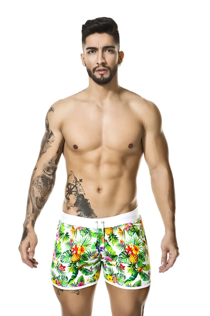 Gigo tropic shorts size m with vibrant tropical print swim trunks featuring white elastic waistband and trim