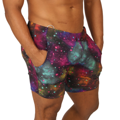 Gigo universe beachwear vibrant galaxy-print swim trunks with magenta teal and purple nebulae and star-like dots