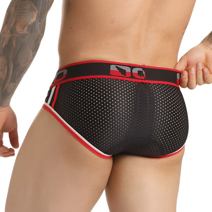Black mesh briefs with red and white trim and bold dc logo on waistband from gigo versatil red brief collection