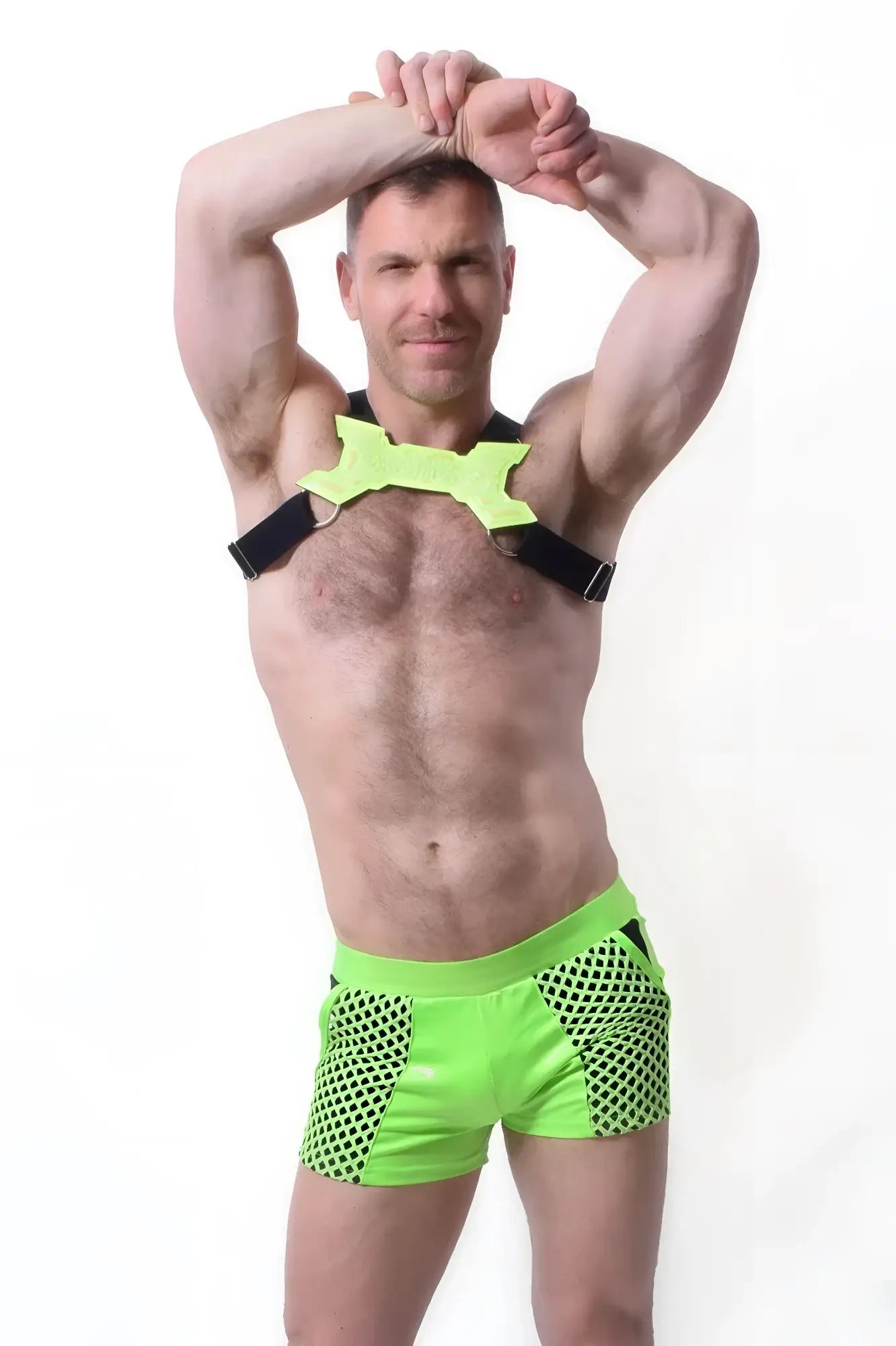 Neon green glowtime shorts in mesh fabric with black trim and matching harness strap for bold activewear looks
