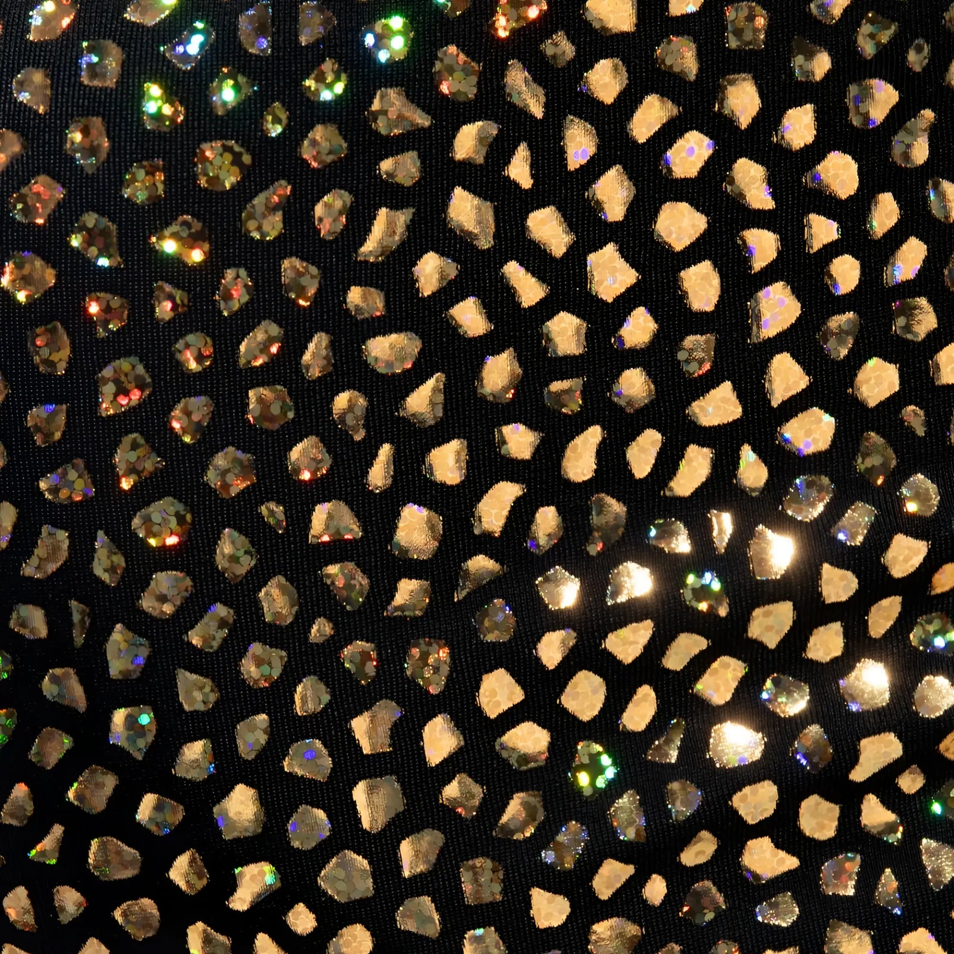 Black gold stones trunk fabric adorned with scattered gold and iridescent rhinestones in a mosaic pattern
