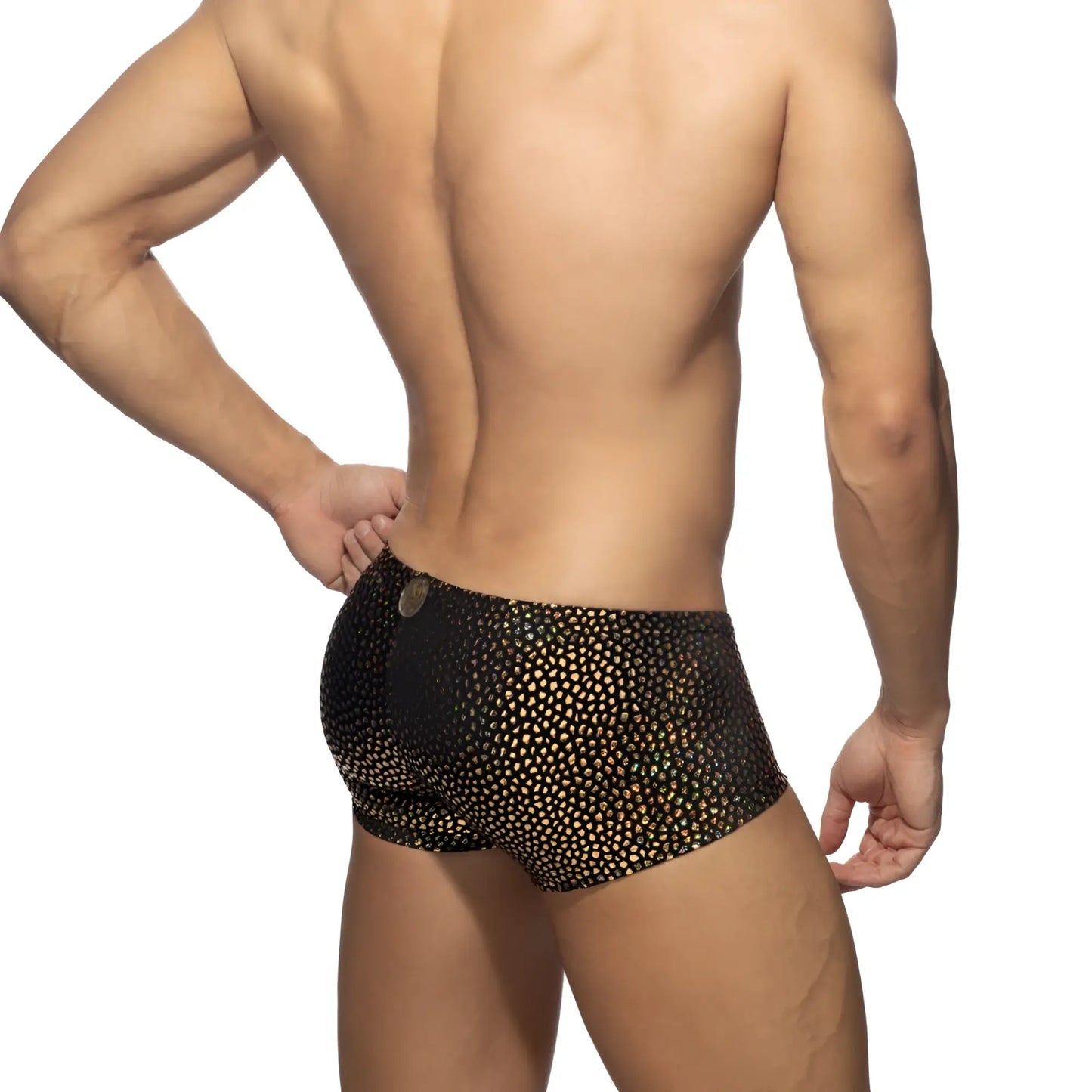 Black swim trunks with shimmering gold dot pattern from gold stones trunk collection for stylish beachwear
