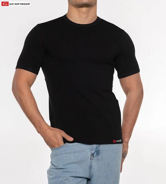 Black short-sleeve tee made of soft material worn by a model with a relaxed fit featuring a small logo at the hem by Go Softwear