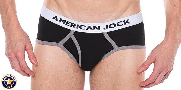 Black men's classic brief with gray accents and an American Jock logo waistband shown on a model's waist