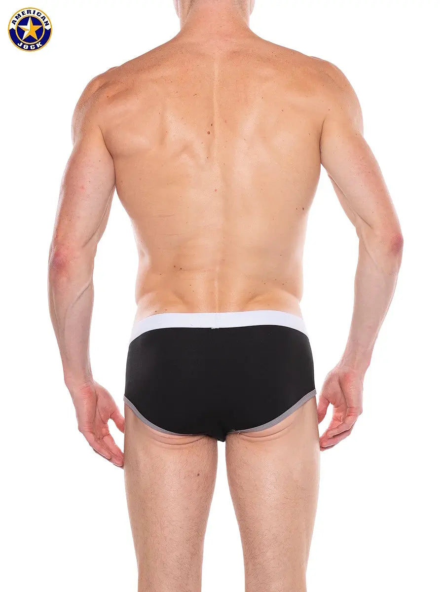 Men's black classic brief with a white waistband shown from the back by AMERICAN JOCK