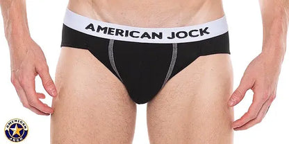 Black bikini underwear with a white waistband featuring 'AMERICAN JOCK' logo shown on a model from the front