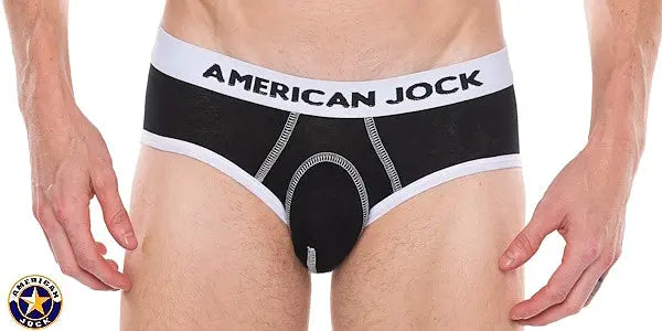 Black men's brief with a white waistband featuring 'AMERICAN JOCK' logo made from soft material with contrast stitching